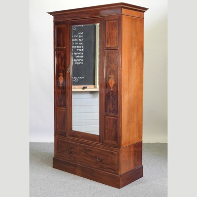 Lot 557 - An Edwardian mahogany and inlaid single wardrobe