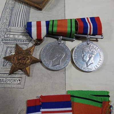 Lot 6 - A group of three World War II medals, together...
