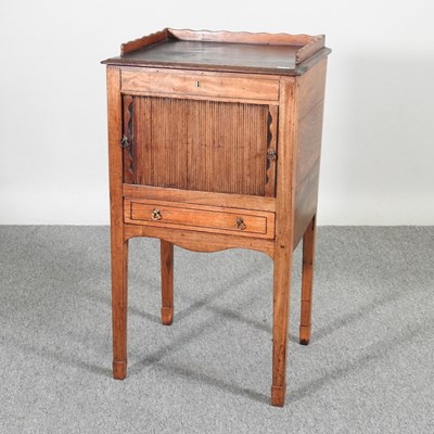 Lot 134 - A George III bedside cabinet, with a tambour...