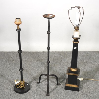 Lot 341 - A gilt and black painted table lamp, together...
