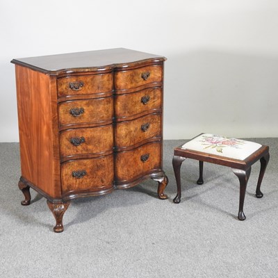 Lot 325 - A 1930's walnut serpentine chest of drawers,...
