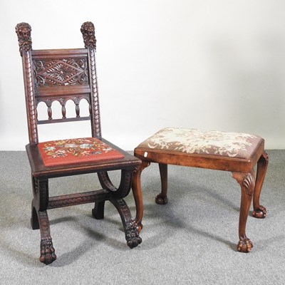 Lot 253 - An early 20th century carved dark oak side...