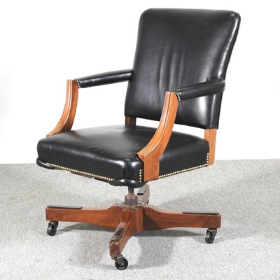 Lot 329 - A modern black upholstered revolving desk chair