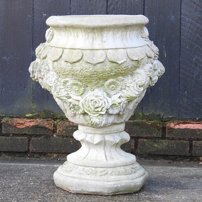 Lot 52 - A cast stone garden urn, decorated with...