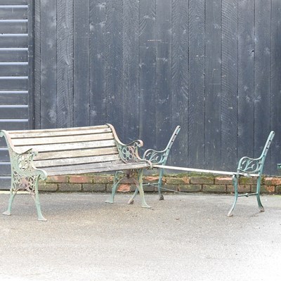 Lot 217 - A cast iron garden bench, 127cm wide, with...
