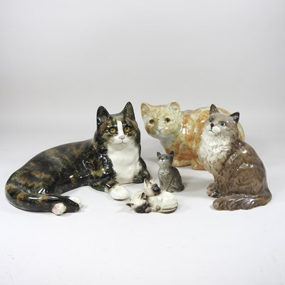 Lot 342 - A Winstanley pottery cat, reclining, painted...