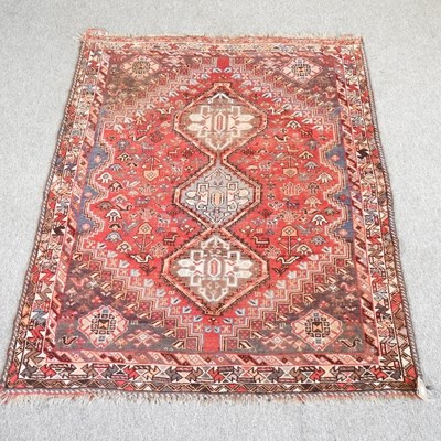 Lot 521 - A Persian rug, with three central diamonds,...