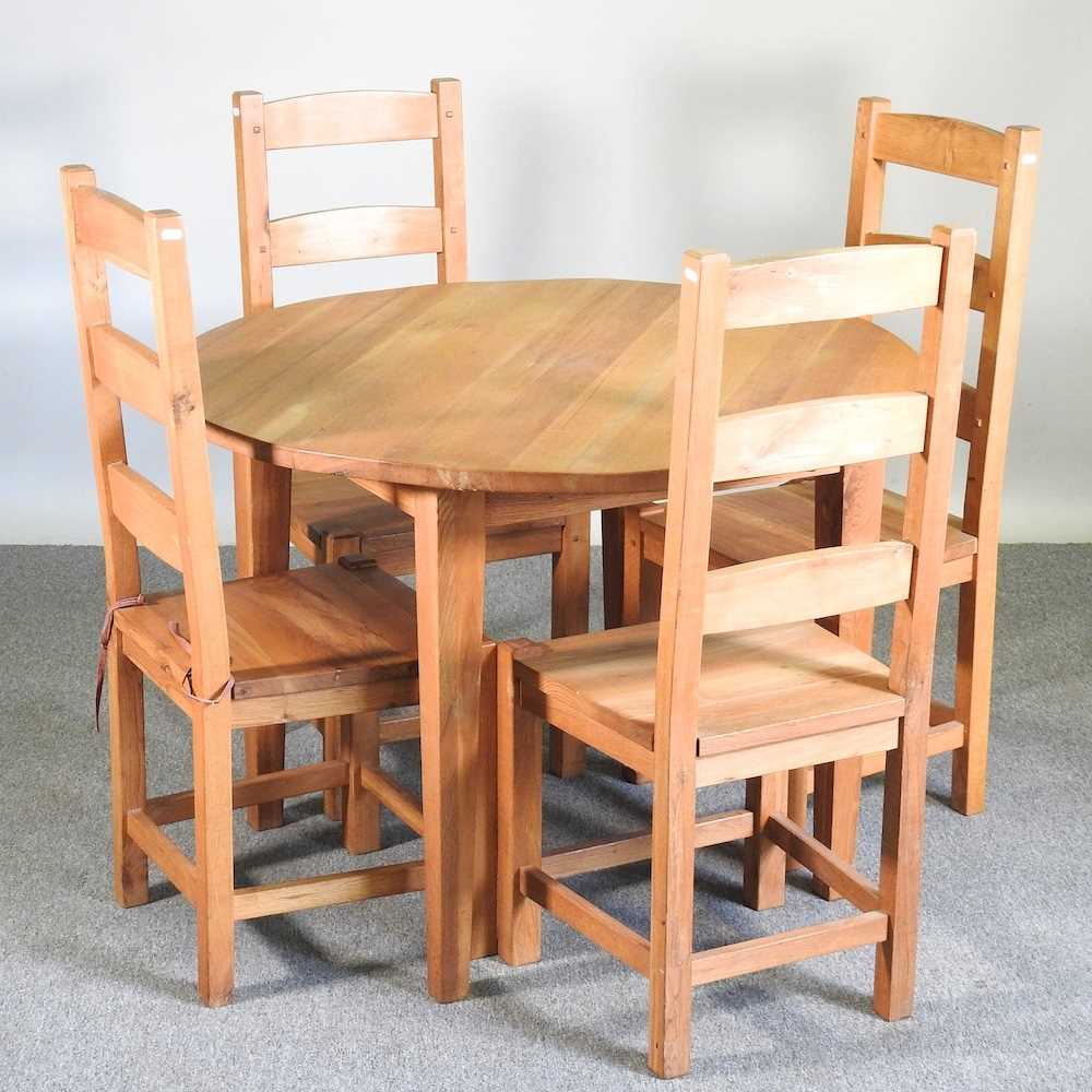 Lot 425 - A modern light oak circular dining table,...