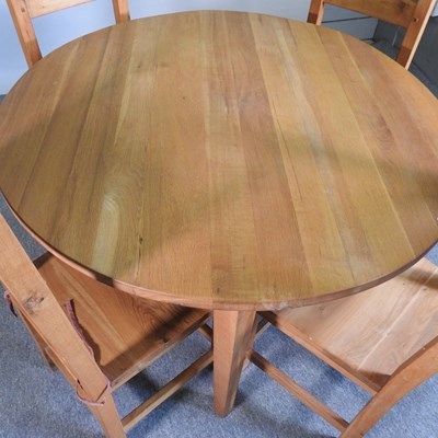 Lot 425 - A modern light oak circular dining table,...