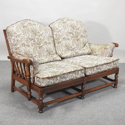 Lot 457 - An Ercol floral upholstered sofa