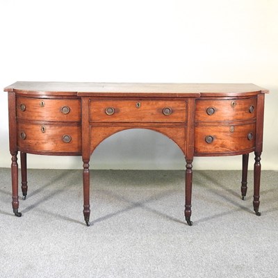 Lot 320 - A Regency mahogany bow front sideboard,...