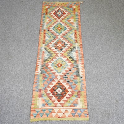Lot 266 - A kelim runner, with five central medallions...