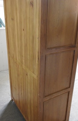 Lot 337 - A modern light oak double wardrobe