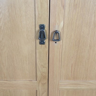 Lot 337 - A modern light oak double wardrobe