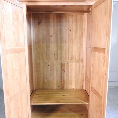 Lot 337 - A modern light oak double wardrobe