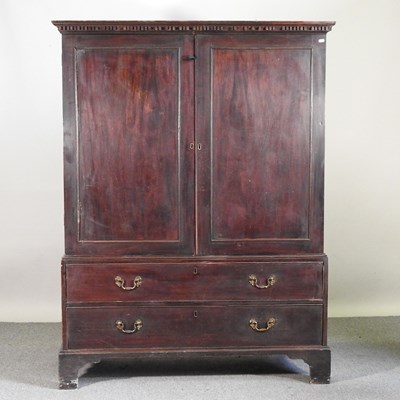Lot 164 - A George III oak dwarf linen press, on bracket...