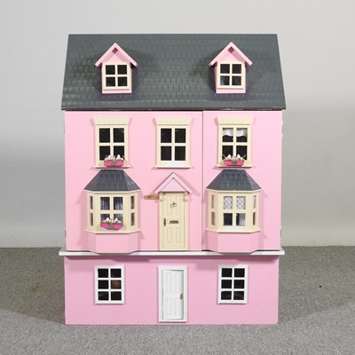 Lot 103 - A pink painted doll's house