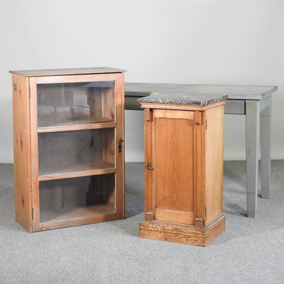 Lot 269 - An antique pine bedside cupboard with a marble...
