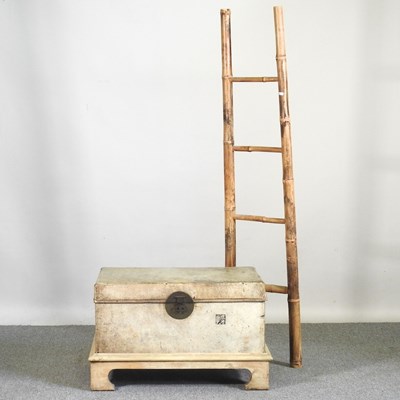 Lot 209 - A Chinese leather trunk on stand, together...