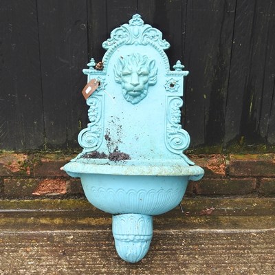 Lot 83 - A blue painted cast iron wall mounted water...