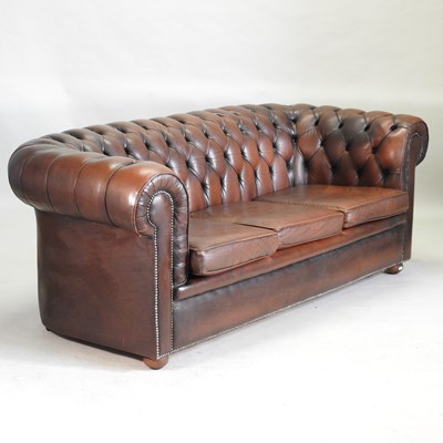 Lot 389 - A brown leather upholstered chesterfield sofa