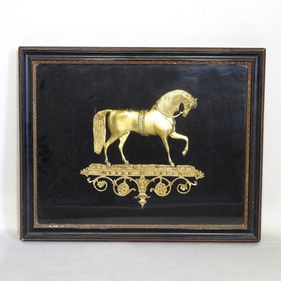 Lot 214 - A 19th century relief gilt metal of a horse in...