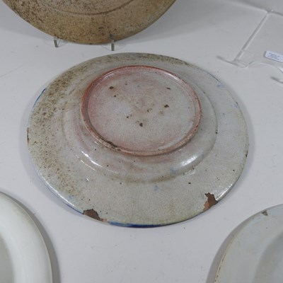Lot 30 - A Persian iznik tin glazed dish, 38cm diameter,...