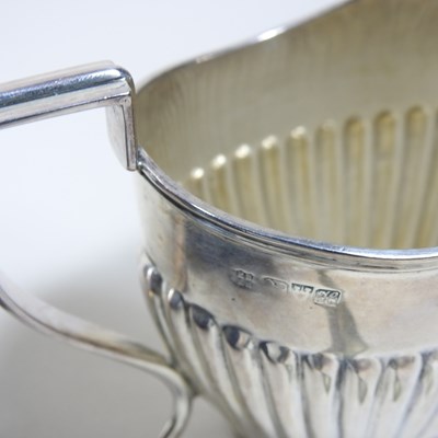 Lot 17 - An Edwardian silver cream jug, Chester 1908,...
