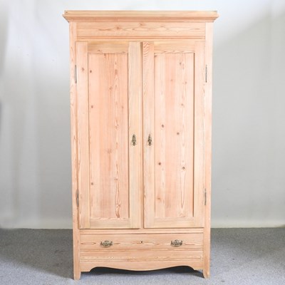 Lot 154 - An antique pine double wardrobe, with a single...