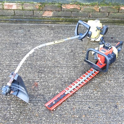 Lot 399 - A petrol hedge cutter, together with a petrol...