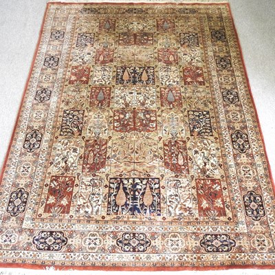 Lot 318 - A persian carpet, with all over floral design,...