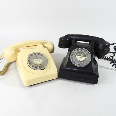 Lot 541 - A vintage black bakelite telephone, together...