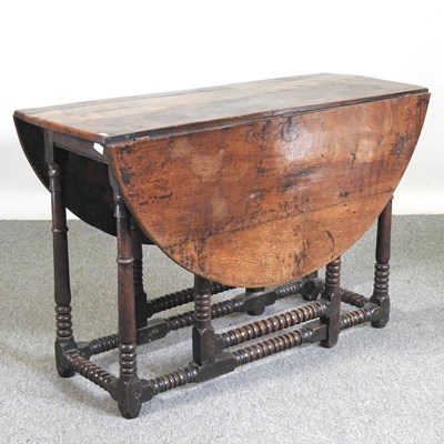 Lot 301 - An 18th century oak gateleg table, with a...