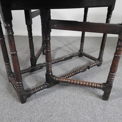 Lot 301 - An 18th century oak gateleg table, with a...
