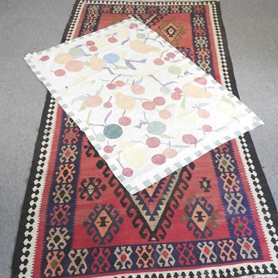 Lot 844 - A kelim rug, with hooked medallions on a red...