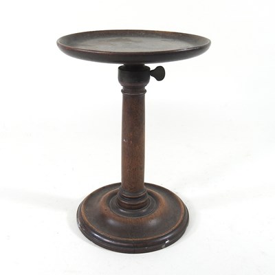 Lot 156 - A 19th century turned mahogany stand, with an...