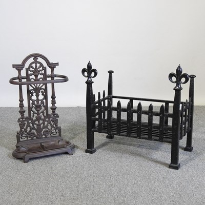 Lot 258 - A cast iron fire grate, 47cm wide, together...