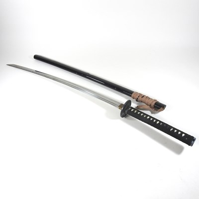 Lot 72 - A modern Japanese sword, with a curved blade...