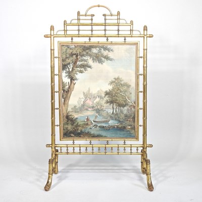 Lot 155 - A 19th century simulated bamboo gilt fire...