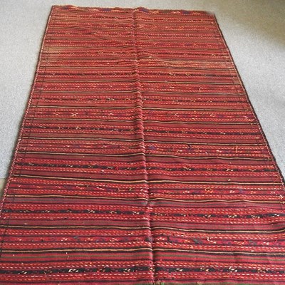 Lot 308 - A Persian kilim, with striped designs, on a...