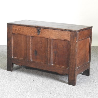 Lot 385 - An 18th century oak coffer, with a hinged lid