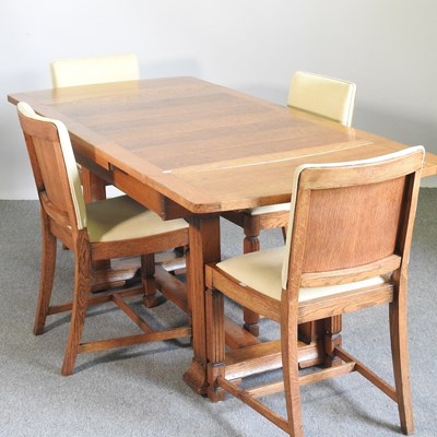 Lot 213 - A 1930's light oak draw-leaf dining table,...