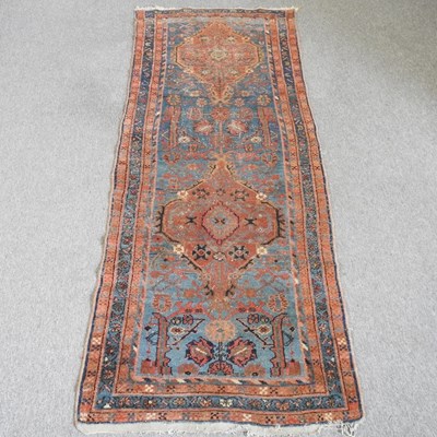 Lot 675 - A malayer runner, with flowerhead designs, on...