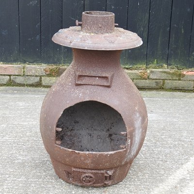 Lot 646 - A metal chiminea, 74cm high