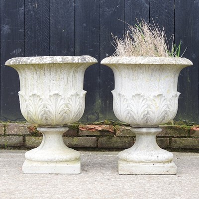 Lot 411 - A pair of cast stone garden urns, of pedestal...