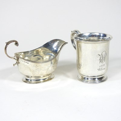 Lot 218 - A Victorian silver mug, with a scrolled handle,...