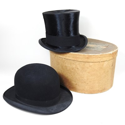 Lot 270 - An early 20th century top hat, bearing a label...