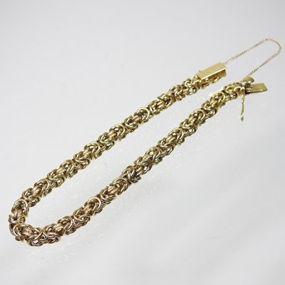 Lot 123 - A 14 carat gold fancy link bracelet, the clasp...