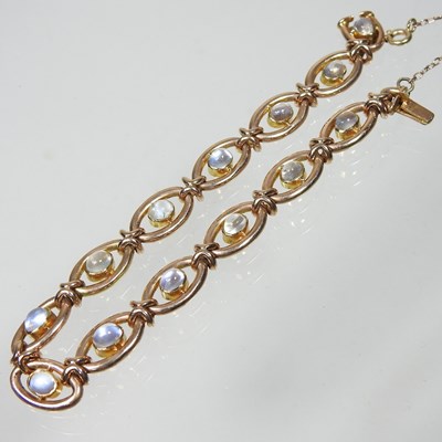 Lot 38 - A 15 carat gold and moonstone fancy link...