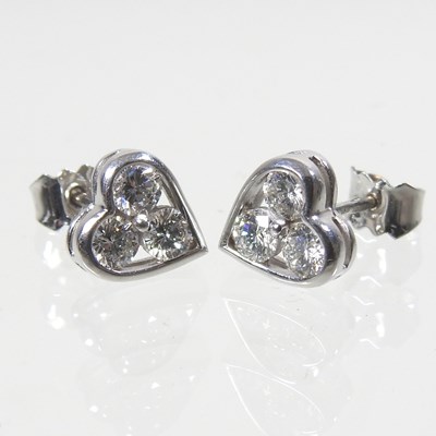 Lot 216 - A pair of 18 carat white gold and diamond...